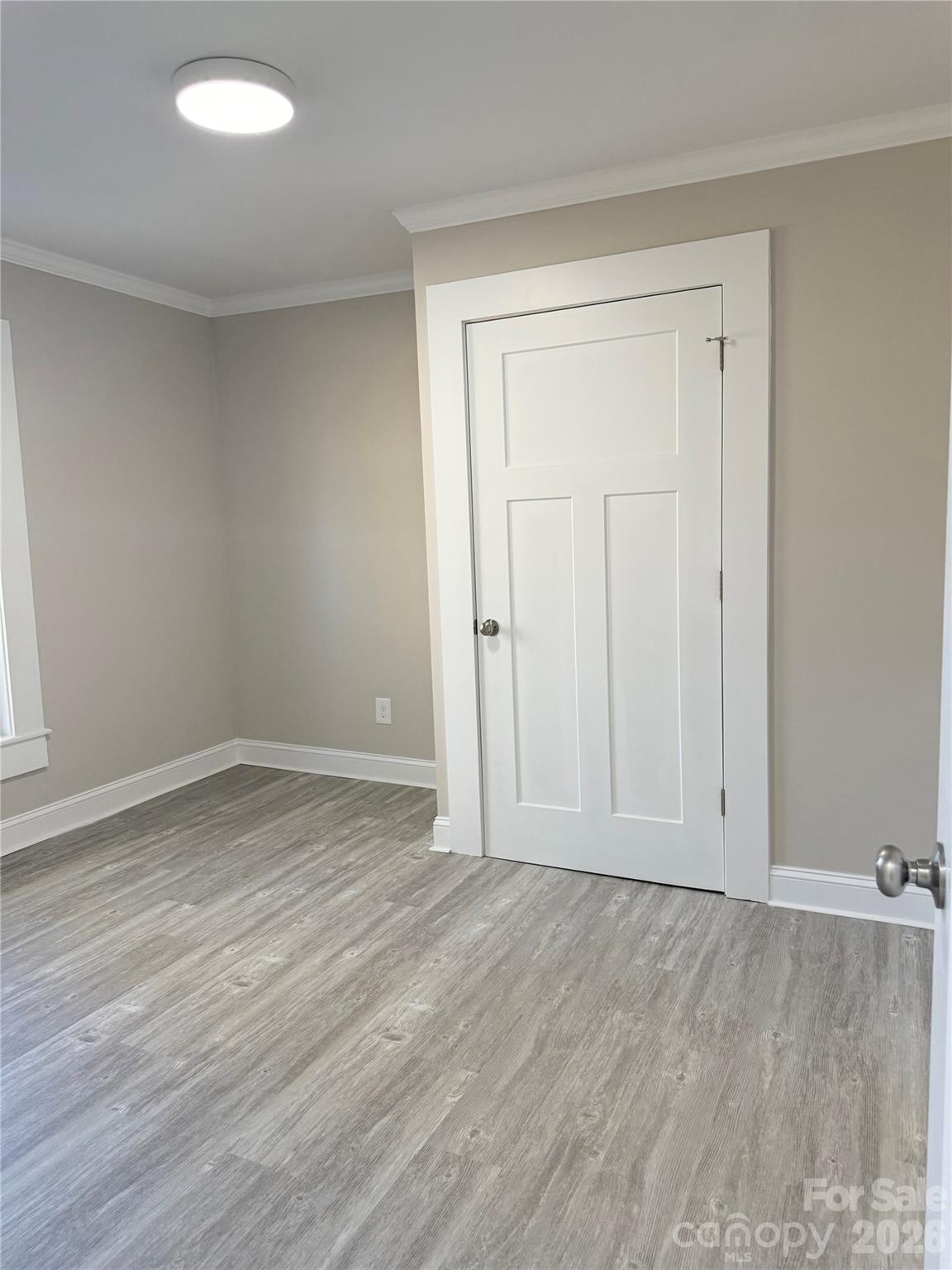 438 Pop Davis Road Taylorsville, NC 28681 - Photo 20 of 31 an empty room with wooden floor and closet