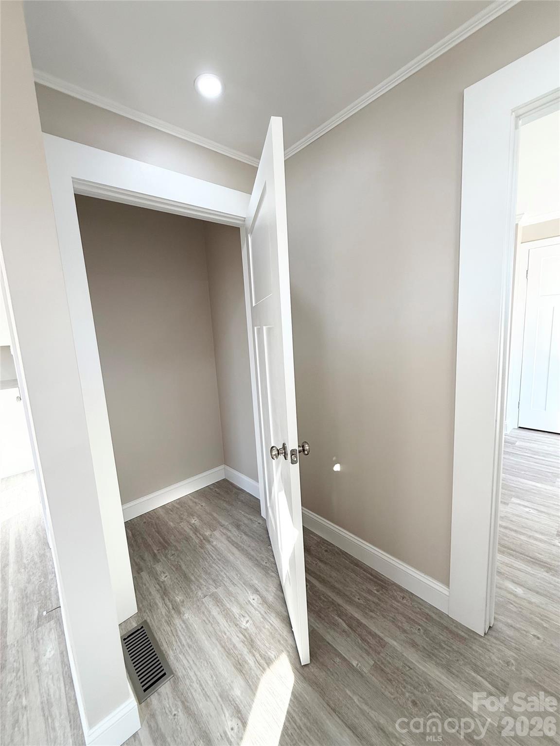 438 Pop Davis Road Taylorsville, NC 28681 - Photo 24 of 31 an empty room with wooden floor and entrance