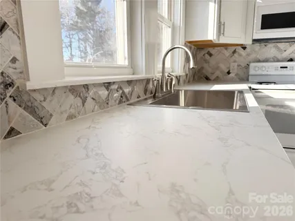 a view of a sink and a window