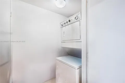 a spacious bedroom with a bed couch and a large window