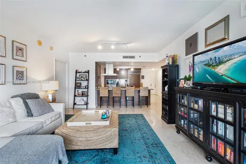 a kitchen with sink a counter and appliances