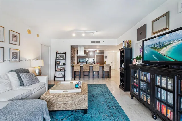 a kitchen with sink a counter and appliances