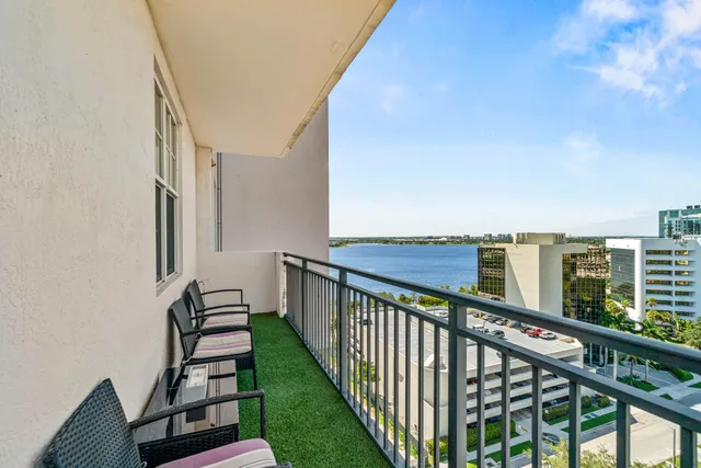 a view of balcony with wooden floor and fence