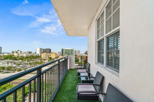 a view of a balcony with city view