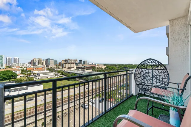 a view of a livingroom with lounge chair and a window