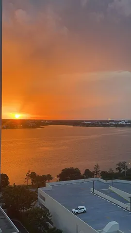 a view of a patio with dining table and chairs