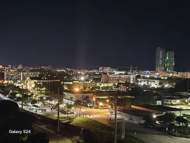 a living room with a rug and a table