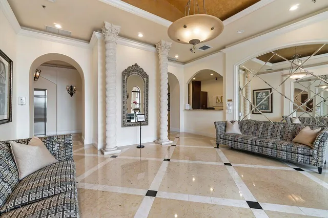 a view of swimming pool with outdoor seating and plants