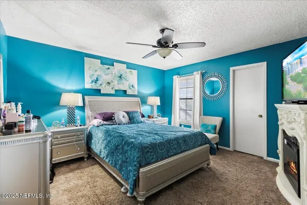 a bed room with a bed and a chandelier