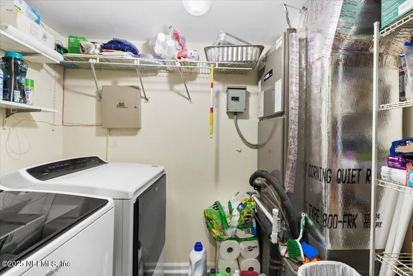 a utility room with dryer and washer