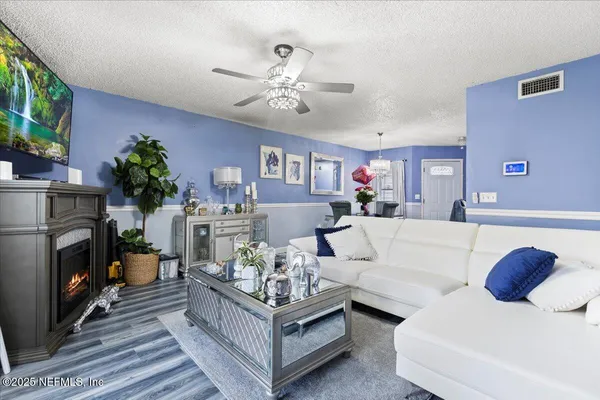 a living room with furniture and a fireplace