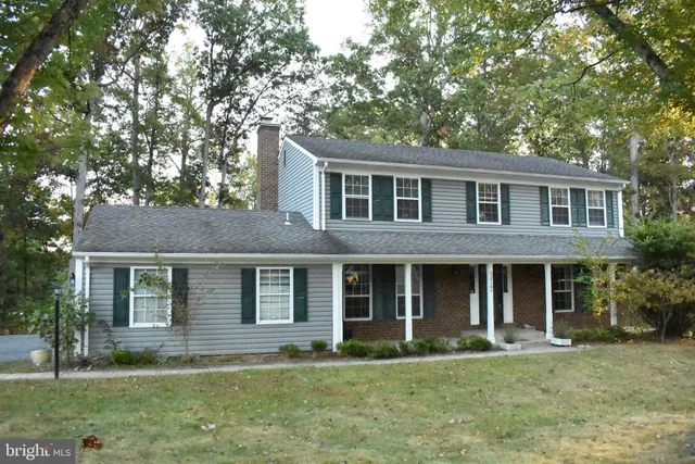 front view of a house that has a yard