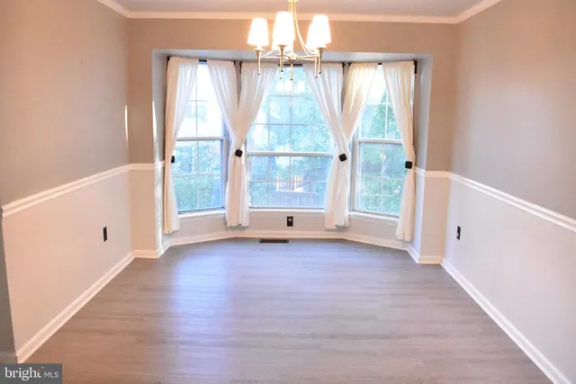a kitchen with stainless steel appliances a stove a sink and a refrigerator