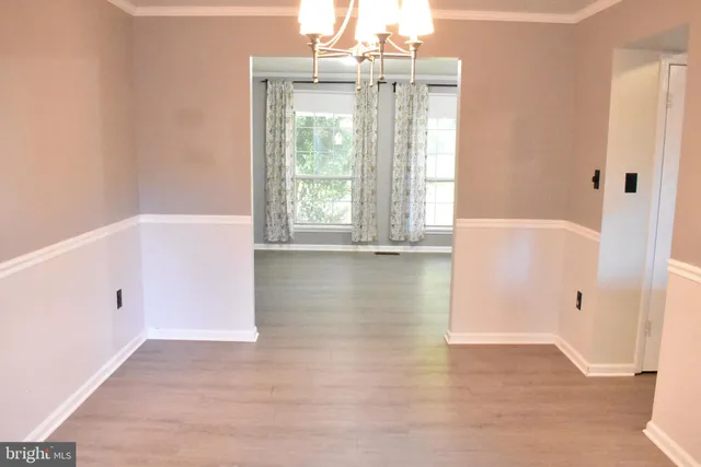 a kitchen with a stove a sink and a refrigerator