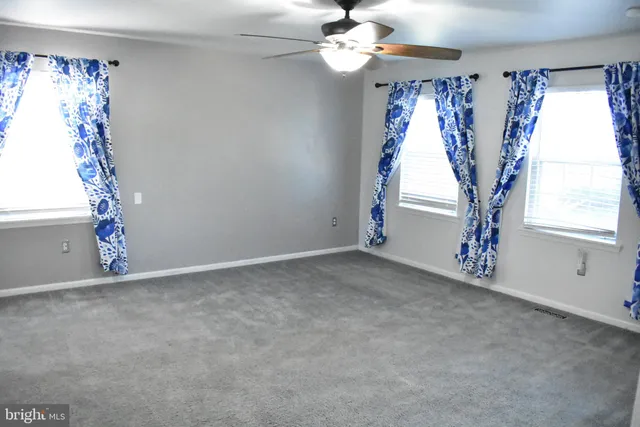 a living room with a black white wall