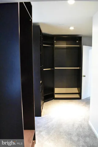 a bathroom with a sink vanity and mirror
