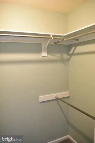 a white toilet sitting next to a window