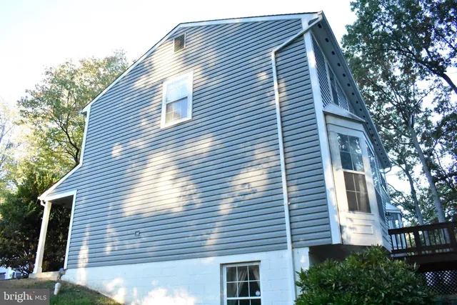 a view of a house with a window and wooden floor