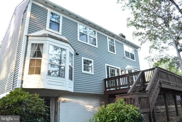 a view of a brick house with a large windows