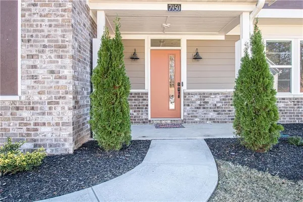 a front view of a house with garden