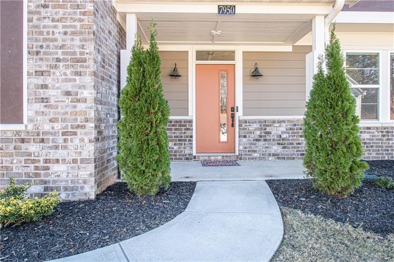 7950 Welch Mill Ball Ground, GA 30107 - Photo 2 of 32 a front view of a house with garden