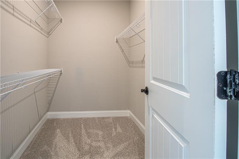 7950 Welch Mill Ball Ground, GA 30107 - Photo 22 of 32 a view of storage and utility room with racks on the wall