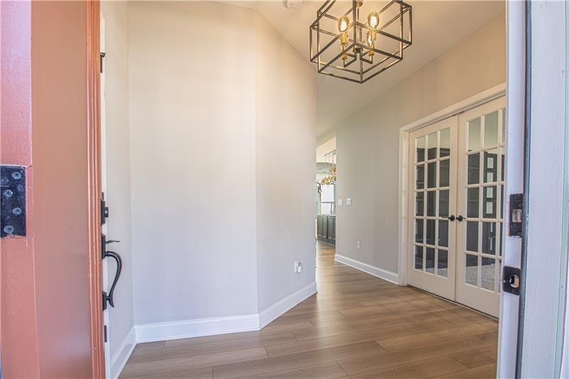 7950 Welch Mill Ball Ground, GA 30107 - Photo 3 of 32 a view of an entryway with wooden floor