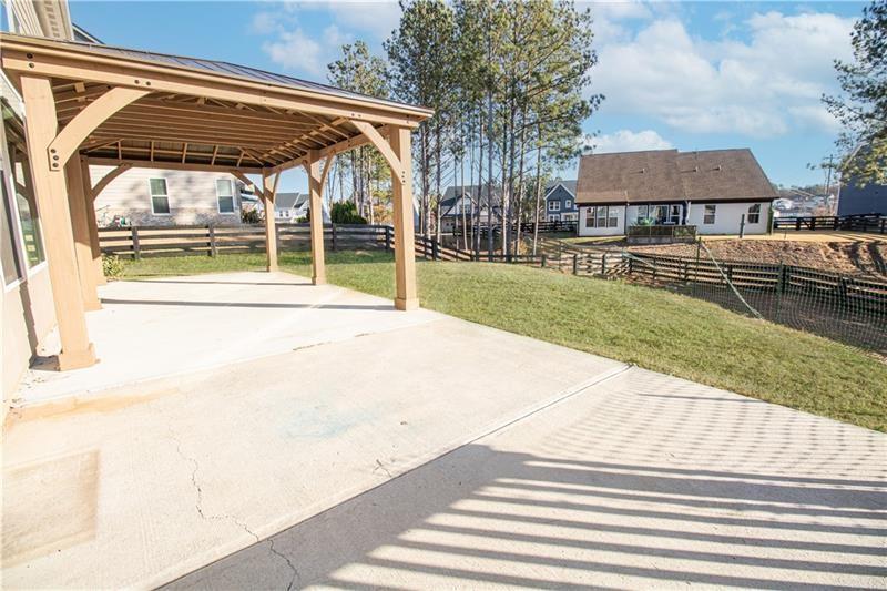 7950 Welch Mill Ball Ground, GA 30107 - Photo 32 of 32 a view of a house with a yard