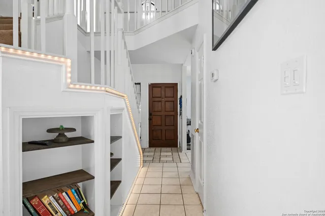 a view of an entryway with wooden floor