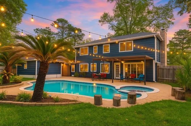 a front view of a house with a yard table and chairs