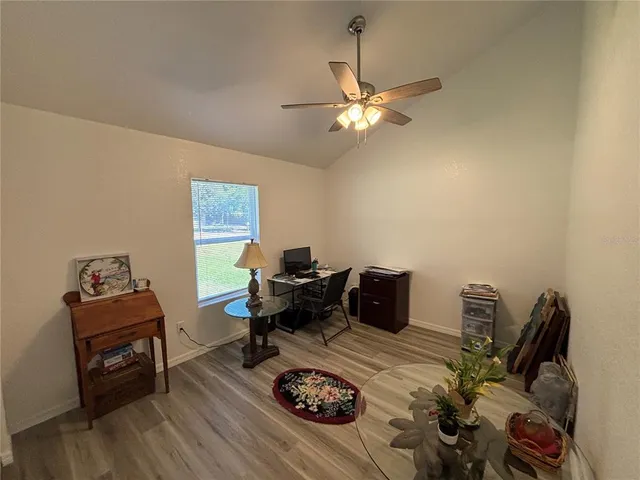 a bed room with furniture and a window