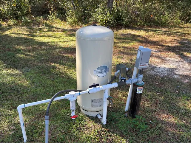 a view of a wooden chairs and a table in the patio
