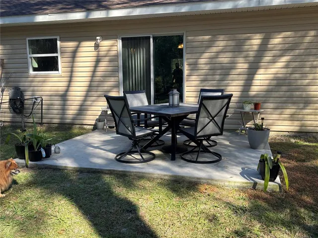 a view of a swimming pool with chairs
