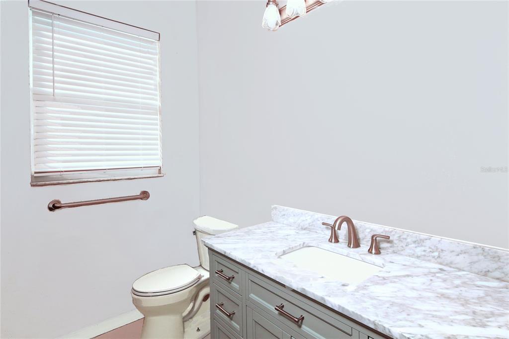 23 West Mickey Mantle Path Hernando, FL 34442 - Photo 22 of 53 a bathroom with a granite countertop sink toilet and mirror