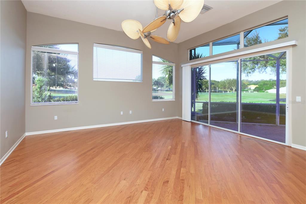 23 West Mickey Mantle Path Hernando, FL 34442 - Photo 8 of 53 a view of an empty room with wooden floor and a window
