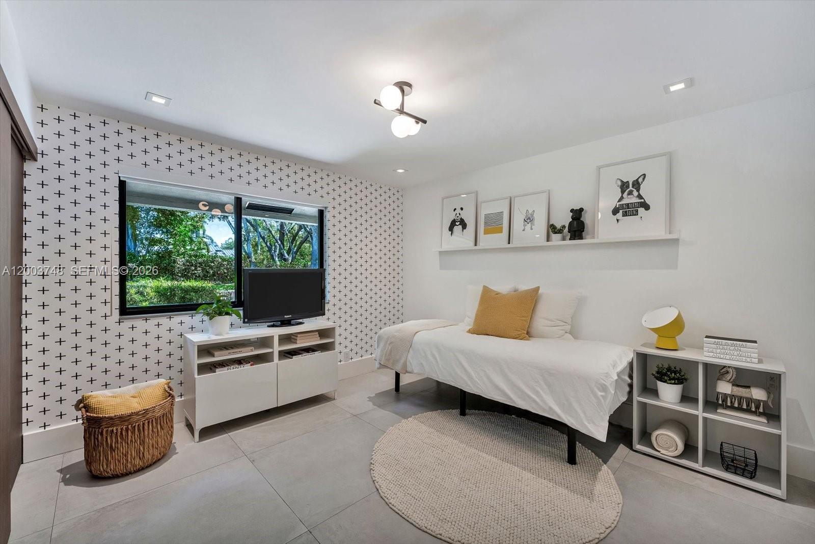 2675 Hackney Road Weston, FL 33331 - Photo 55 of 61 a living room with furniture and a flat screen tv