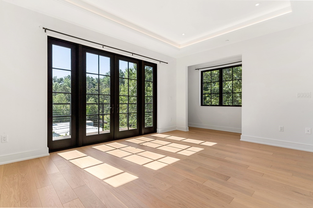 148 Weston Road, Unit 207 Wellesley, MA 02482 - Photo 15 of 25 a view of a room with a large window