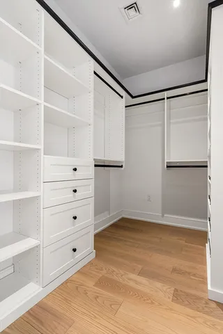 a view of an empty walk in closet