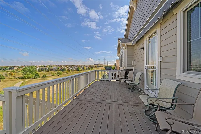 a view of balcony with furniture
