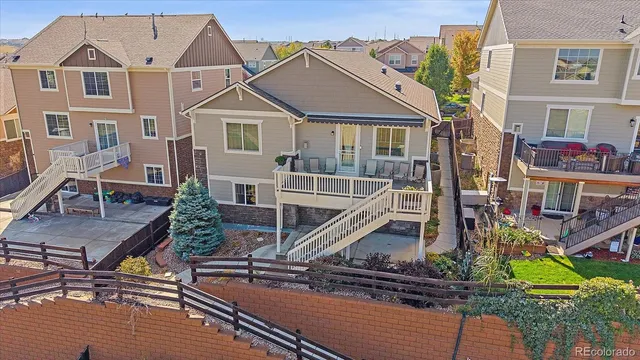 an aerial view of house with yard swimming pool and outdoor seating