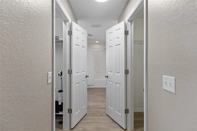 a bathroom with a sink a toilet a mirror and shower