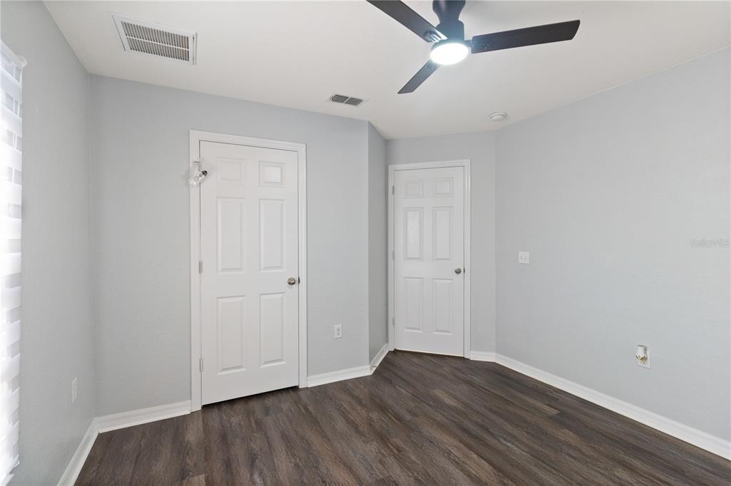 12374 Corrine Avenue Spring Hill, FL 34609 - Photo 18 of 28 a view of an empty room with wooden floor