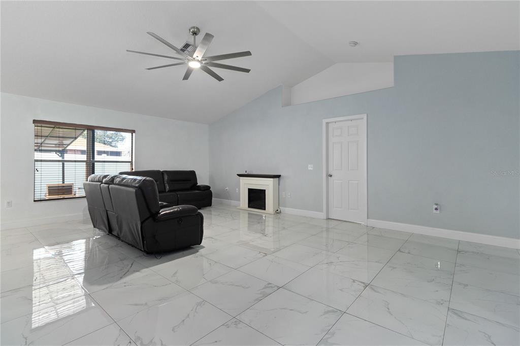 12374 Corrine Avenue Spring Hill, FL 34609 - Photo 19 of 28 a living room with furniture and hard wood floor