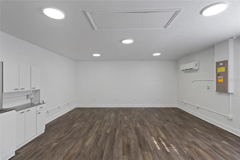 12374 Corrine Avenue Spring Hill, FL 34609 - Photo 21 of 28 wooden floor in an empty room with a window