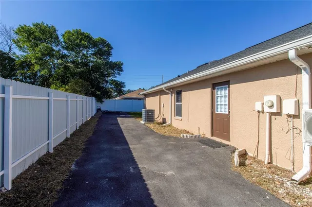 an aerial view of multiple houses with yard