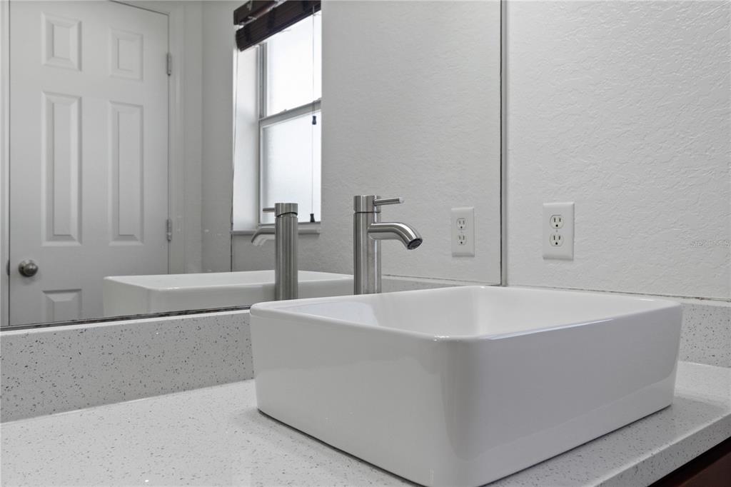 12374 Corrine Avenue Spring Hill, FL 34609 - Photo 10 of 28 a white bath tub sitting in a bathroom