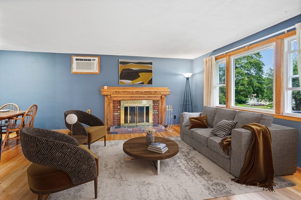 4 Freeman Road Chelmsford, MA 01824 - Photo 5 of 38 a living room with furniture and a fireplace
