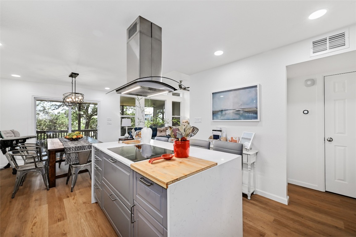 225 Comanche Lane Point Venture, TX 78645 - Photo 11 of 40 a living room with furniture and wooden floor