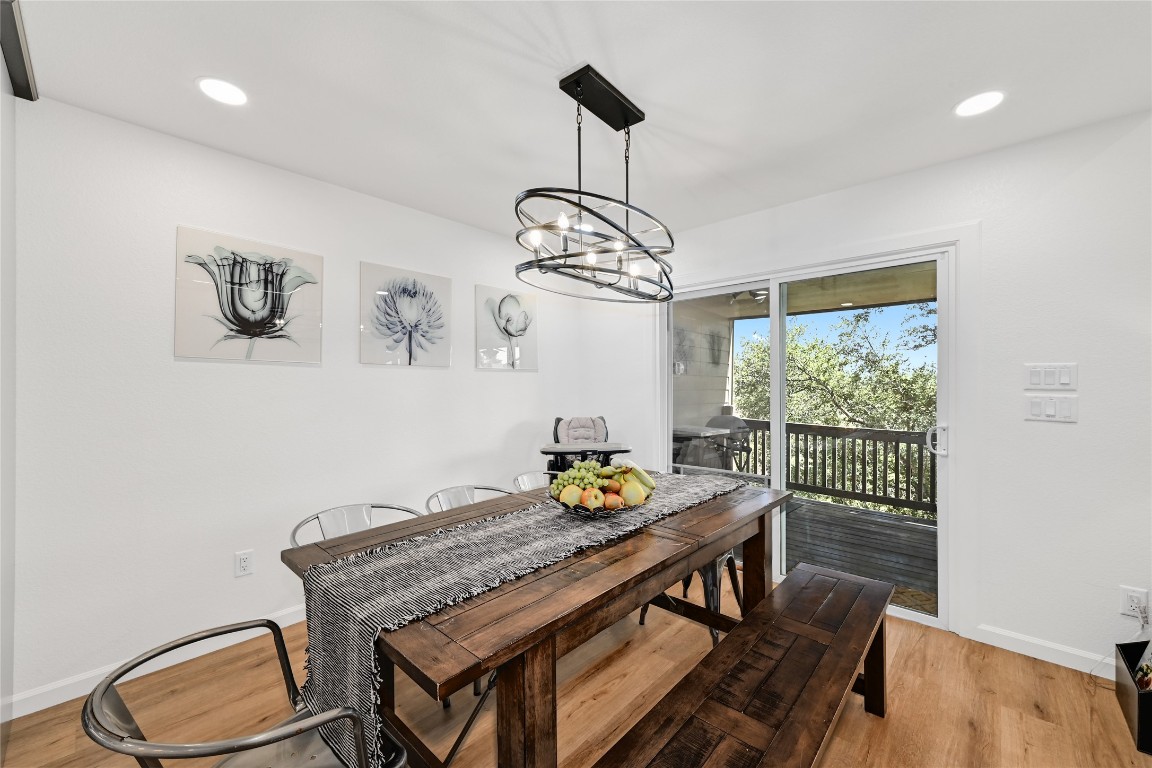225 Comanche Lane Point Venture, TX 78645 - Photo 14 of 40 a view of a dining room with furniture window and outside view