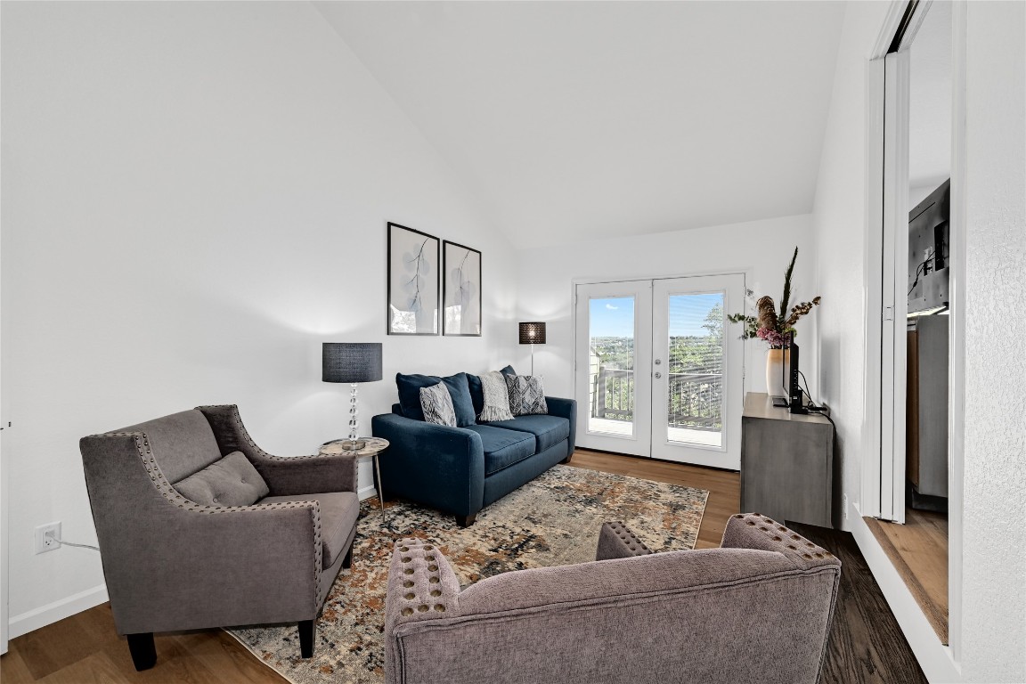 225 Comanche Lane Point Venture, TX 78645 - Photo 16 of 40 a living room with furniture and a window